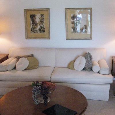 Sofa, framed artwork, coffee table, end tables, lamps