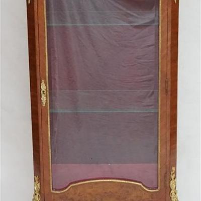 Early 20th c. French Ormolu Mounted Marble Top Vitrine. Beveled glass locking door and two beveled glass sides. Red velvet back and...