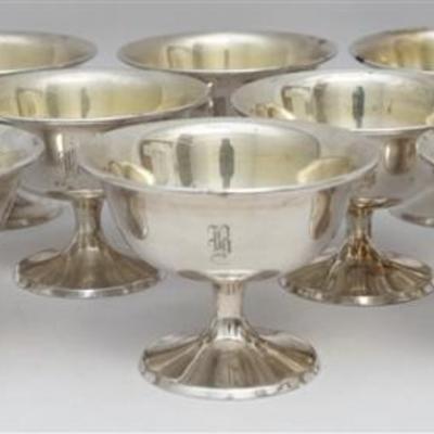 A set of twelve vintage Manchester Silver Company sterling silver low sherbet dishes. The dishes have slightly curved rims and sit on...