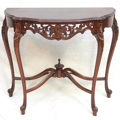 20th c. Mahogany French Regency Demi Lune Console Table. Hand carved and pierced skirt and carved cabriole legs.