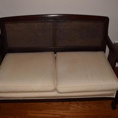 Cane back settee with upholstered cushions. Excellent condition.