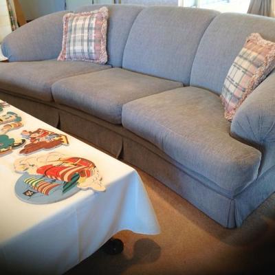 Pair of blue sofas and matching plaid chair