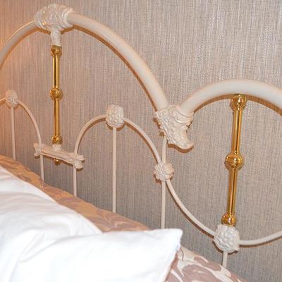 Ornate Victorian style white painted iron and brass queen size bed