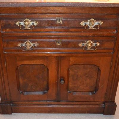 Victorian burled walnut wash stand with griffin-head pulls and marble top