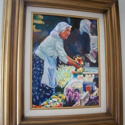 Woman at the market painting