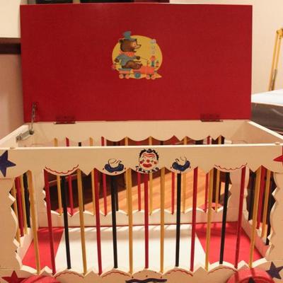 Vintage circus-cage child's toy chest with wheels