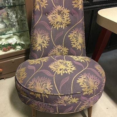 Mid-century modern slipper chair professionally upholstered in a dramatic purple and gold floral fabric