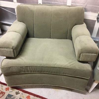 One of two mid-century modern club chairs newly upholstered in a soft sage green fabric. These are fantastic chairs!