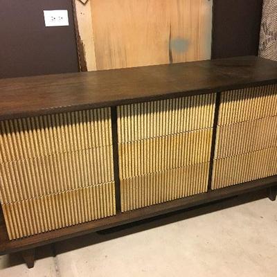 American of Martinsville 9-drawer dresser stained a dark walnut color with original color drawer fronts. Also included is the...