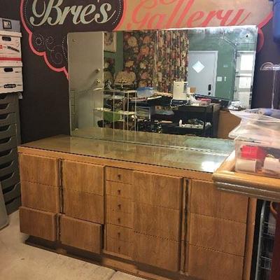 Beautiful large American of Martinsville dresser with attached rounded beveled mirror. The bottom left drawer just needs a small fix -...