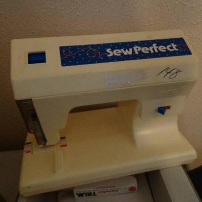 2 Sew perfect sewing machines in case.