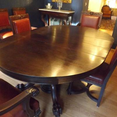 Split pedestal dining room table. Claw feet. 4 leaves. Seats 12.