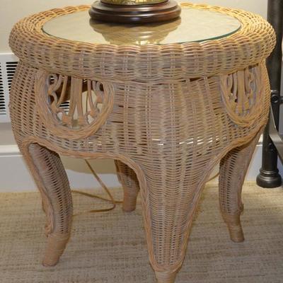 Round wicker accent table with glass top