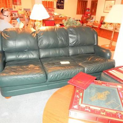 FANTASTIC LOVE SEAT, SOFA, AND OTTOMAN IN A RICH DARK GREEN LEATHER.