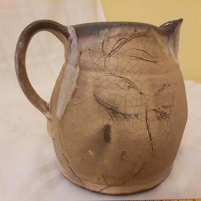 Hand made clay pitcher