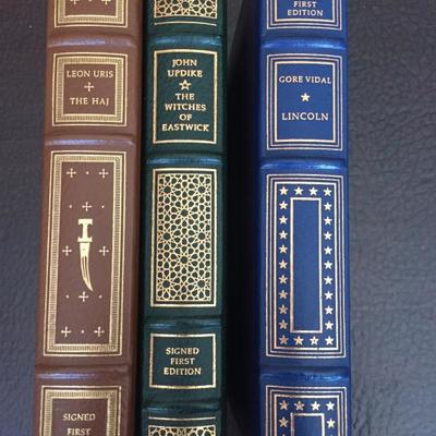 Signed First Editions from the Signed First Edition Society of The Franklin Library: 'The Haj' by Leon Uris, 'The Witches of Eastwick' by...