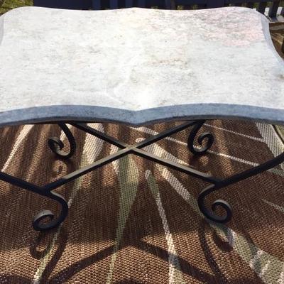 Marble-top and wrought iron table.