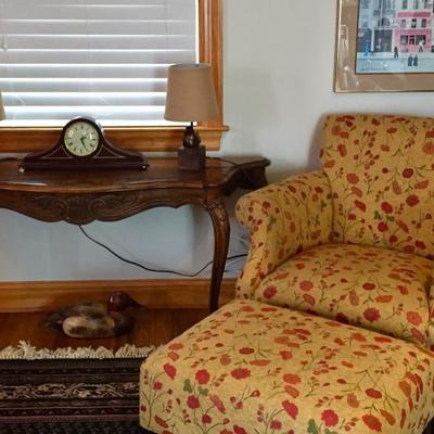 Carved wood side table, vintage duck decoy, pair of bird lamps, table clock, matching upholstered chair and ottoman.