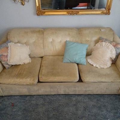 Tan 3 cushion hide-a-bed sofa w/ pillows