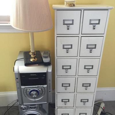 Stereo sets and file cabinet.