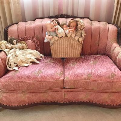 One of two matching vintage settees