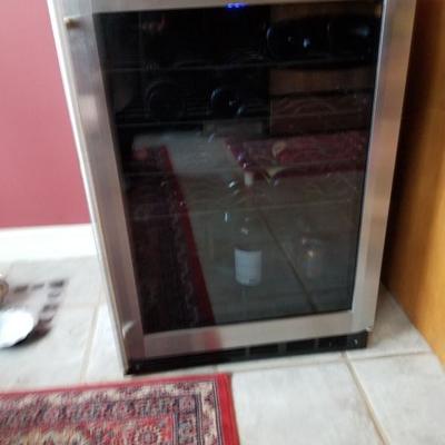 Wine refridgerator - you stock it! 6 shelves. Clean and like new.