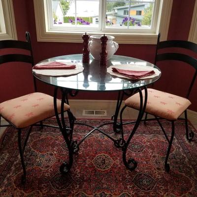 Heavy wrought iron cafe table set, 2 chairs. 