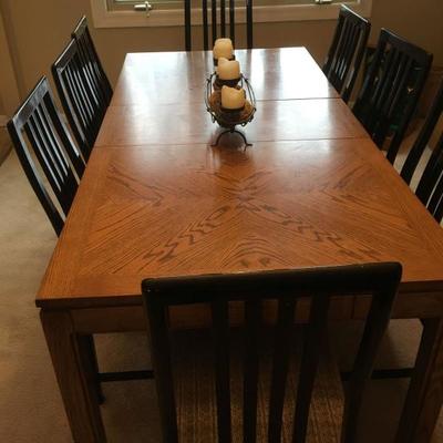 large dining table w/ 2 leaves and 8 chairs
