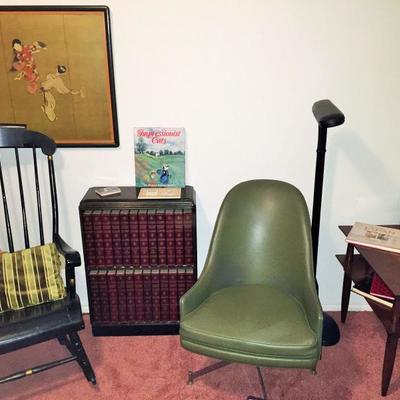 Great green desk chair, Oriental wall art, black rocking chair, and the Encyclopedia Britannica.