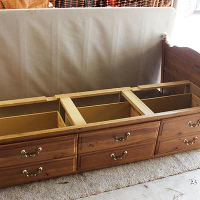 Twin size bed with storage drawers below