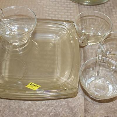 Set of four square glass dishes with cups