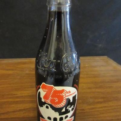 Large 75th Anniversary Coca Cola bottle.