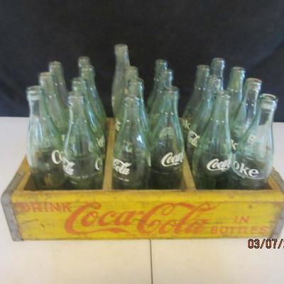 Vintage Coca Cola crate with glass bottles. 