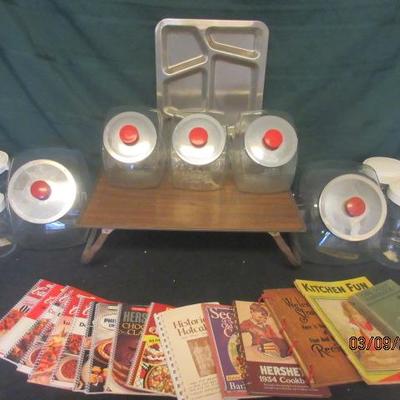 Vintage food trays and storage containers with collectable magazines. 