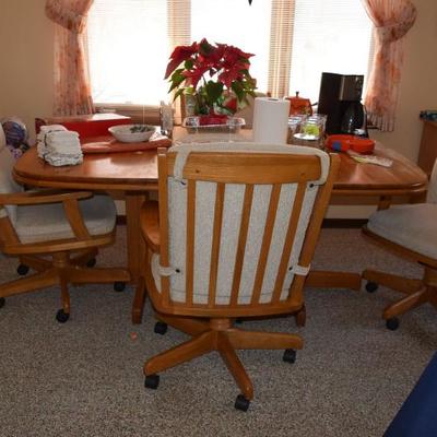 Dining room table with chairs with casters