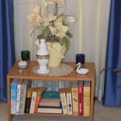 Books, small table, silk floral arrangement
