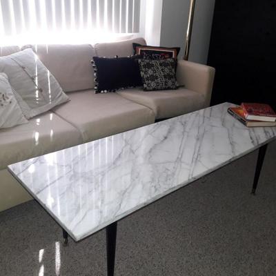 Sofa bed with marble coffee table