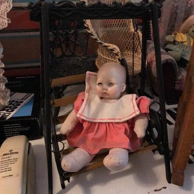 Vintage doll and cast iron doll swing