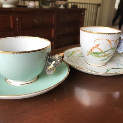 Cup and saucer with butterfly handles. No markings.