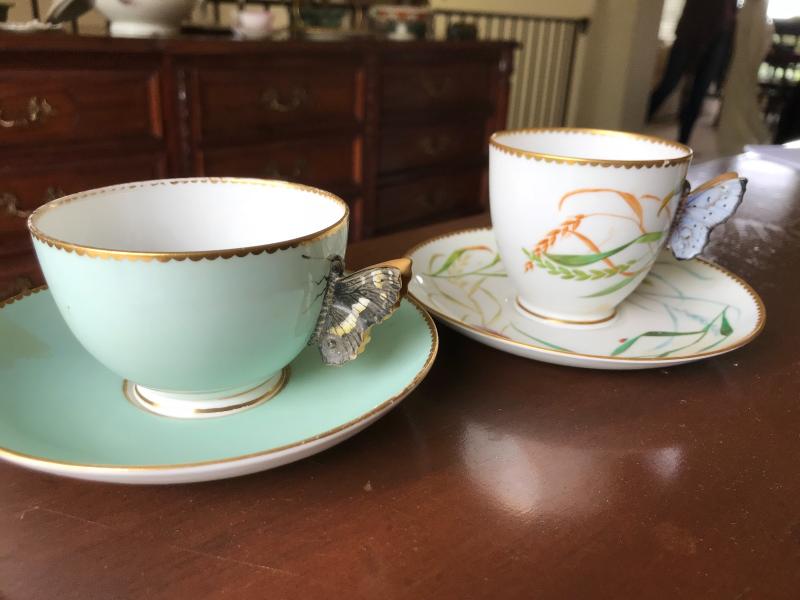 Cup and saucer with butterfly handles. No markings.