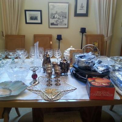 Misc. housewares, table cloths, silverware, silver plated tea set, glassware, etc. Come by and pick through.