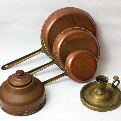 collection of functional and decorative items in copper and brass