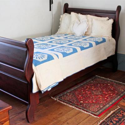 Twin size sleigh bed with hand made quilts - a matching pair.