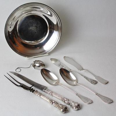sterling silver collection including plate, cutlery set, tea ball, and serving pieces