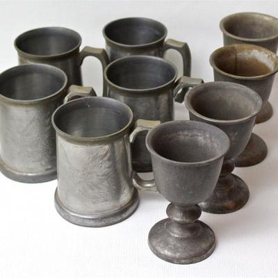 collection of pewter, including mugs and other drinking vessels