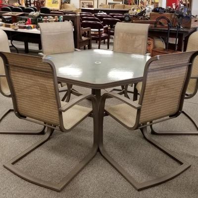 glass table top patio set w/ 6 chairs. like new