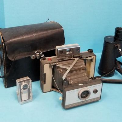 polaroid camera, binoculars