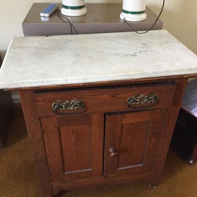 Marble Top Cabinet.