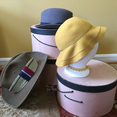 Set of hat boxes and hats.