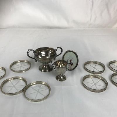 Lot #66

Sterling Liver Coasters and Misc. Holloware